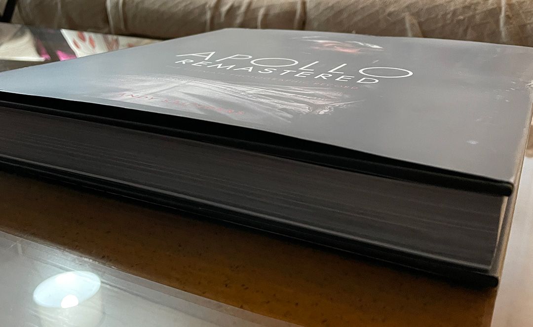 A side view of Andy Saunder's book Apollo Remastered showing how thick it is