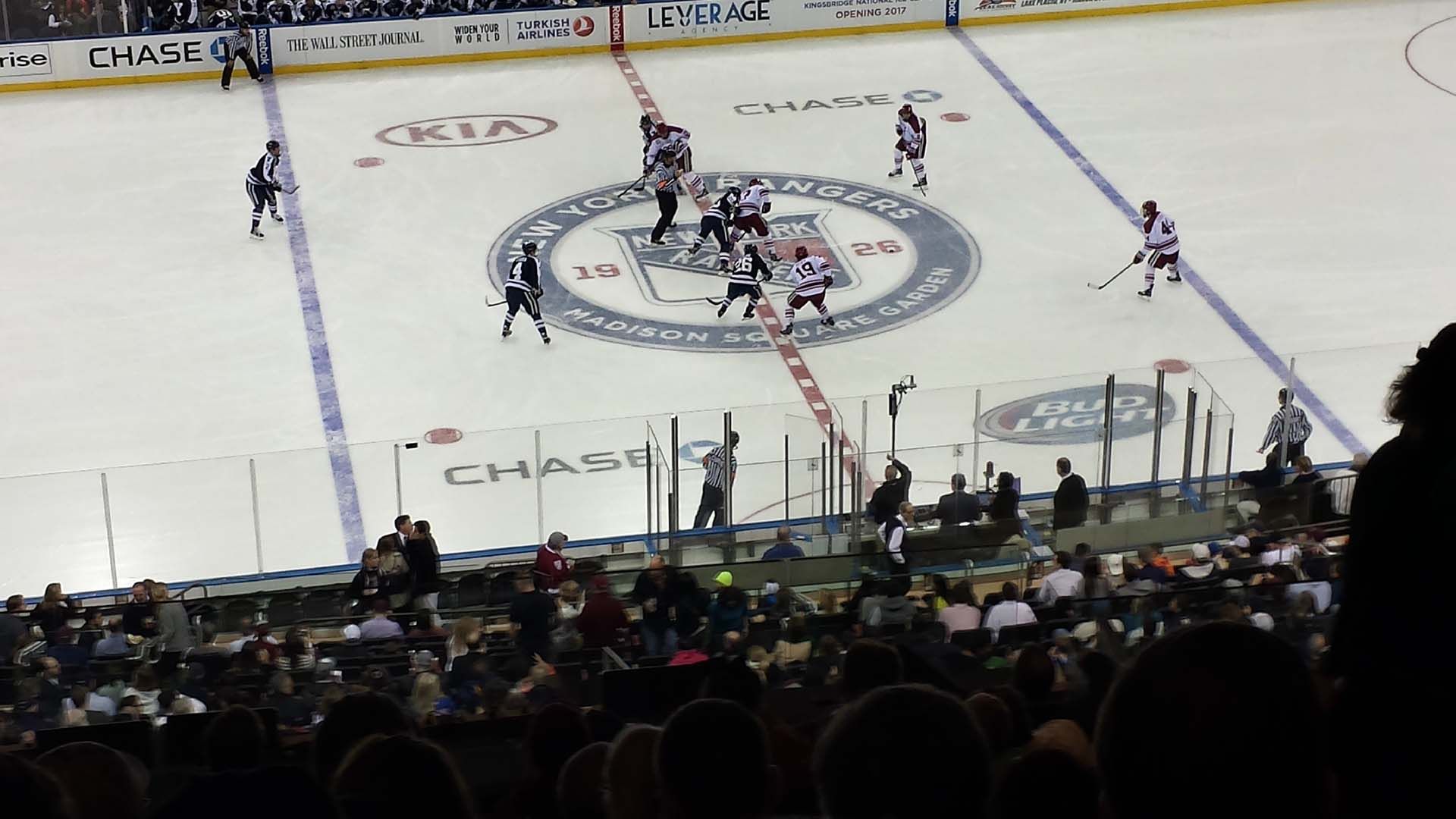 The Harvard and Yale Hockey teams facing off in Madison Square Garden in New York City