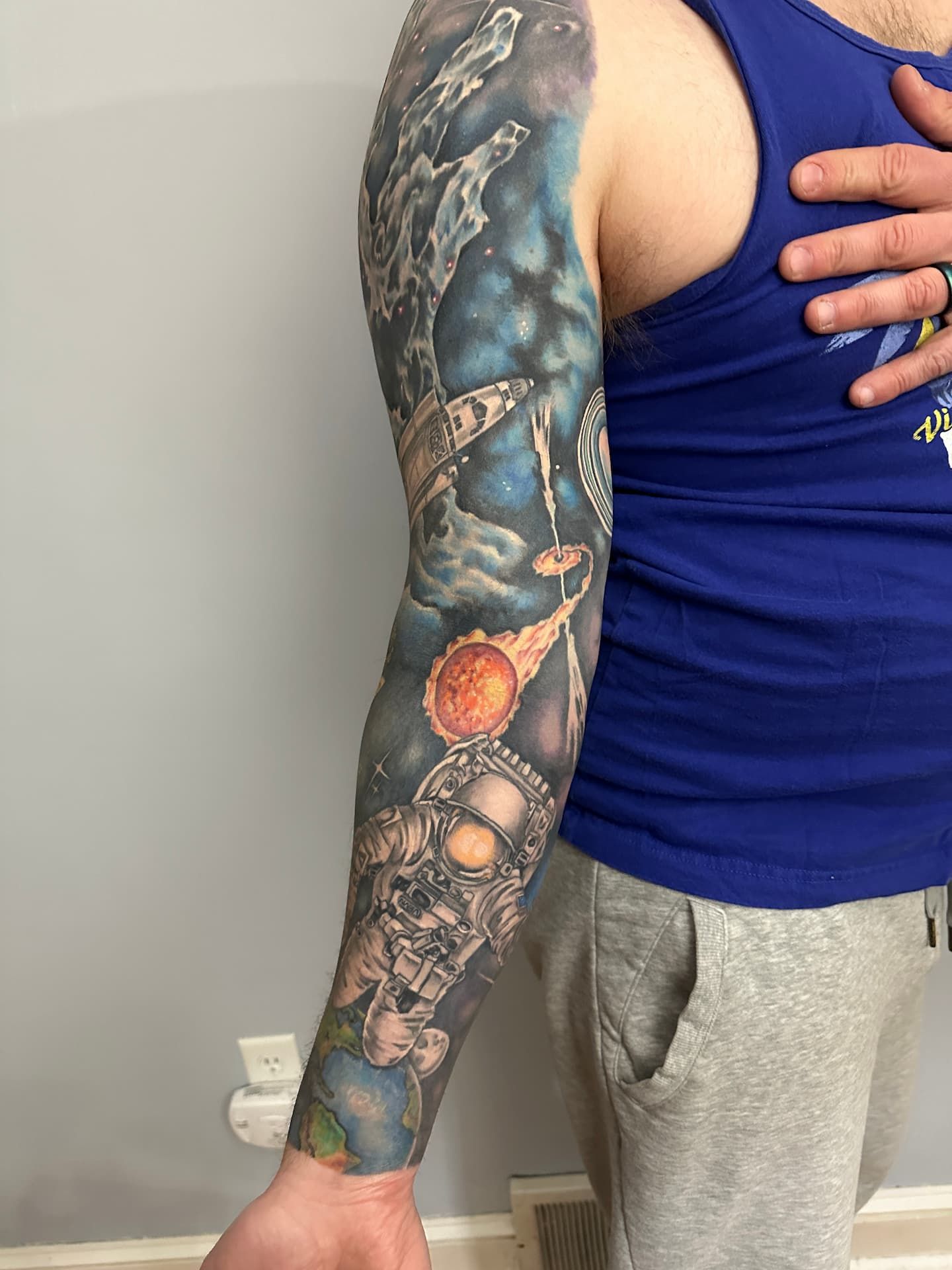 The inside of my sleeve featuring earth, an astronaut, and a type 1a supernova