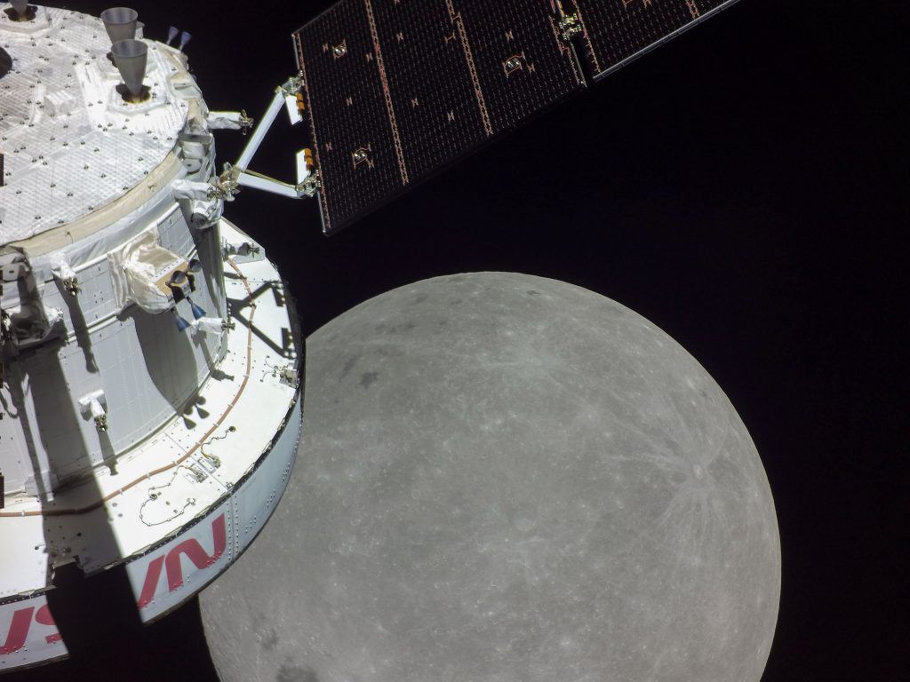 NASA's Orion capsule floating in space with the Moon in the background